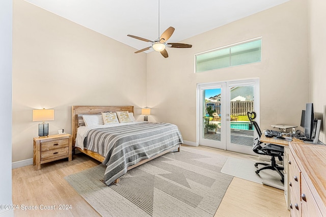 bedroom with french doors, light wood-type flooring, access to outside, and ceiling fan