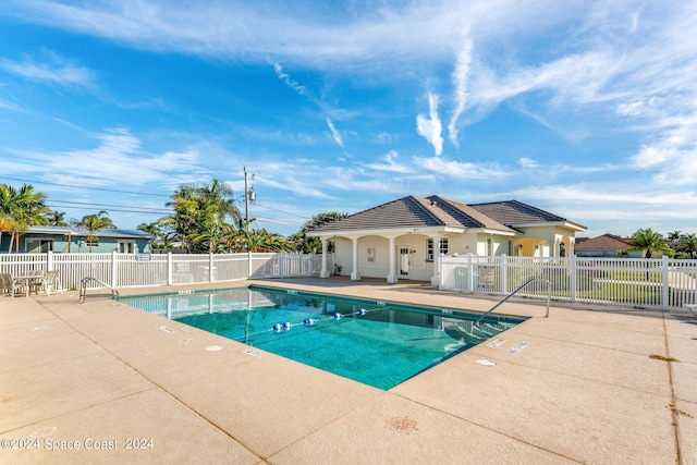 view of swimming pool with a patio area