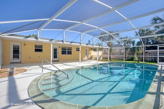 view of pool featuring a lanai and a patio area