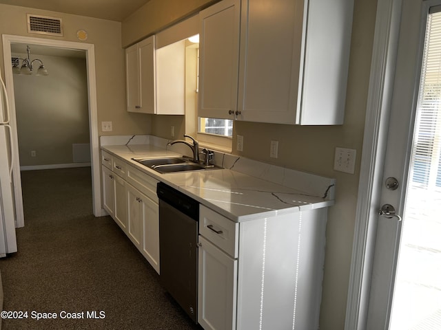 kitchen featuring light stone countertops, white cabinetry, stainless steel dishwasher, and sink