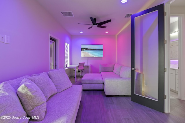 living room with ceiling fan and wood-type flooring