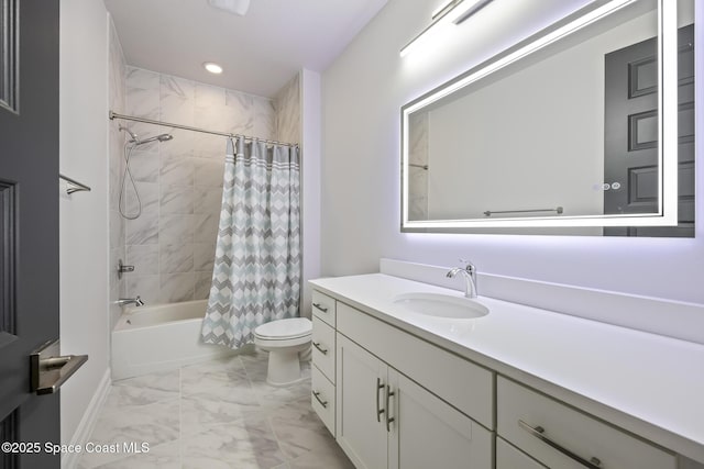 full bathroom featuring shower / bath combo, vanity, and toilet