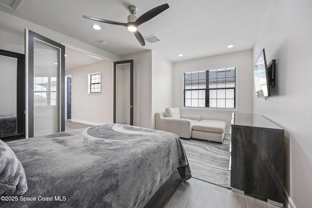 bedroom featuring ceiling fan and light hardwood / wood-style floors