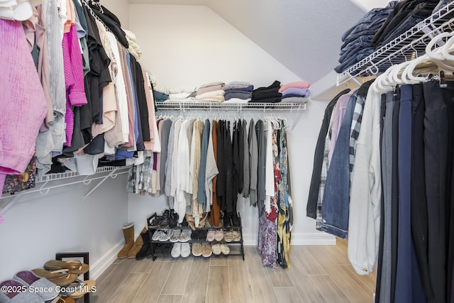 spacious closet featuring lofted ceiling