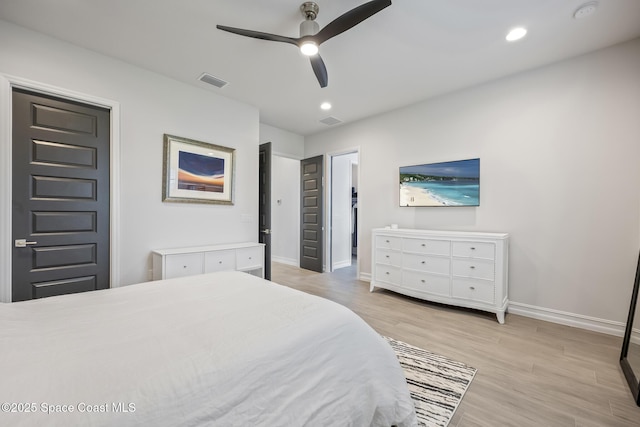 bedroom with ceiling fan and light hardwood / wood-style flooring