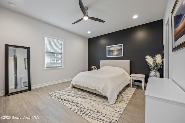 bedroom featuring ceiling fan and light hardwood / wood-style flooring