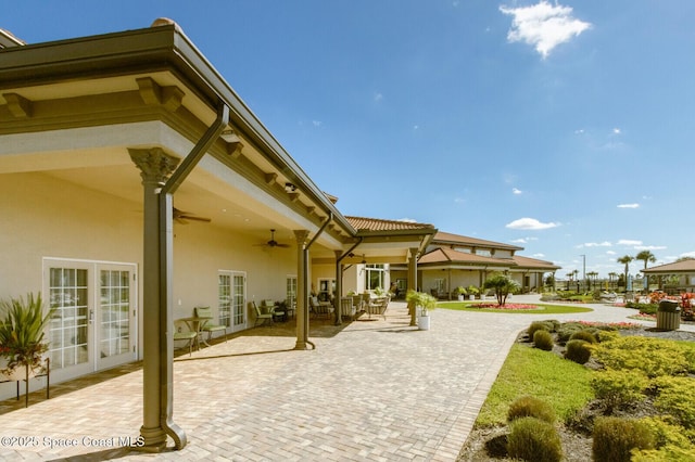 back of house with ceiling fan, a patio area, and french doors