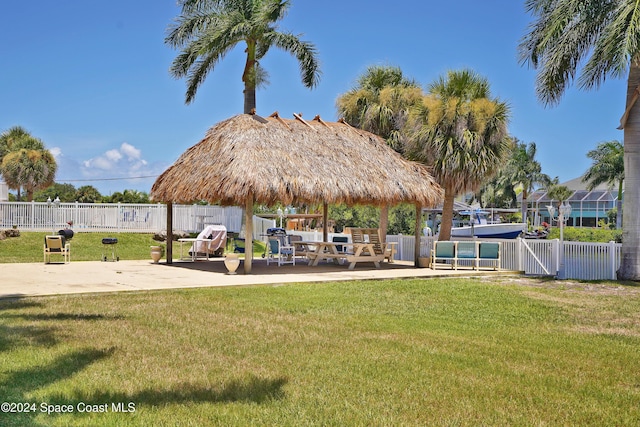 view of property's community with a gazebo, a yard, and a patio