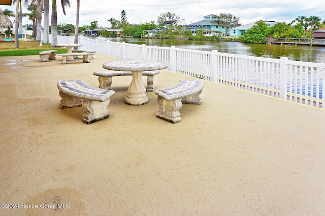 view of patio featuring a water view