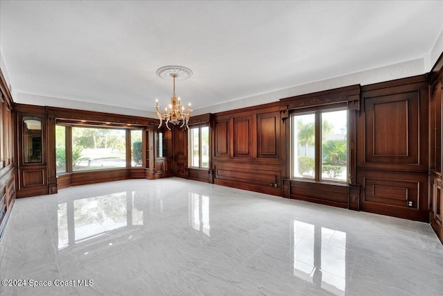 unfurnished dining area with an inviting chandelier