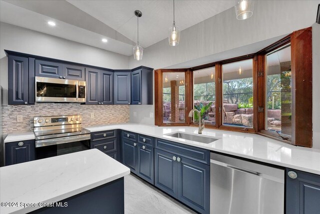 kitchen with backsplash, stainless steel appliances, blue cabinets, and sink