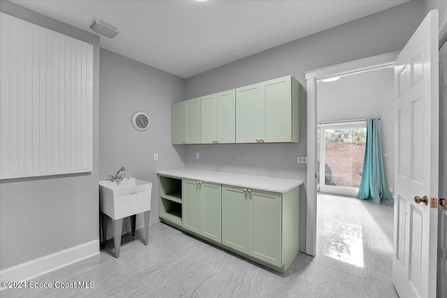 kitchen featuring green cabinets