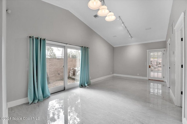 empty room with lofted ceiling, rail lighting, and ornamental molding