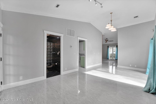 empty room featuring ceiling fan, crown molding, and lofted ceiling