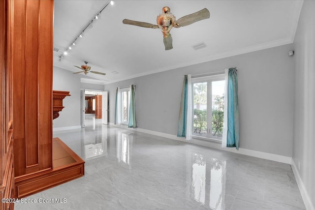 spare room with ornamental molding and a wealth of natural light