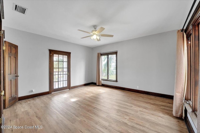 spare room featuring ceiling fan and light hardwood / wood-style floors