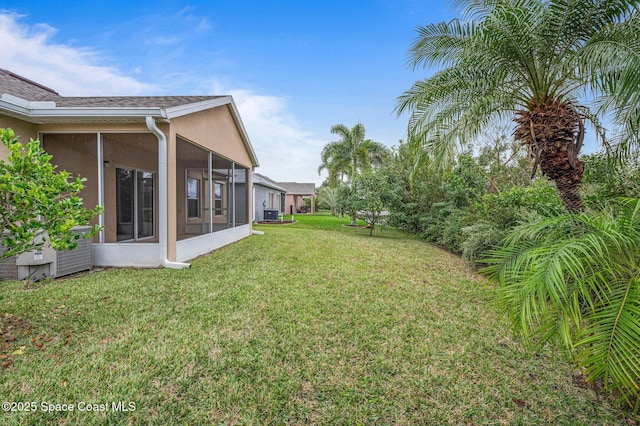 view of yard with a sunroom