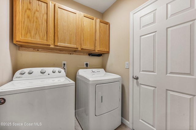 laundry area with cabinets and independent washer and dryer