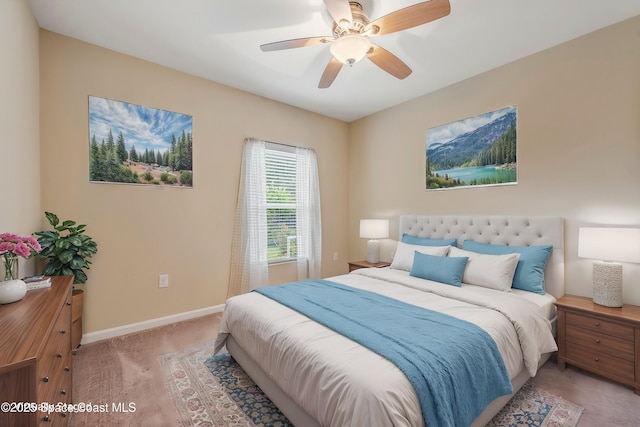 bedroom featuring ceiling fan and light colored carpet