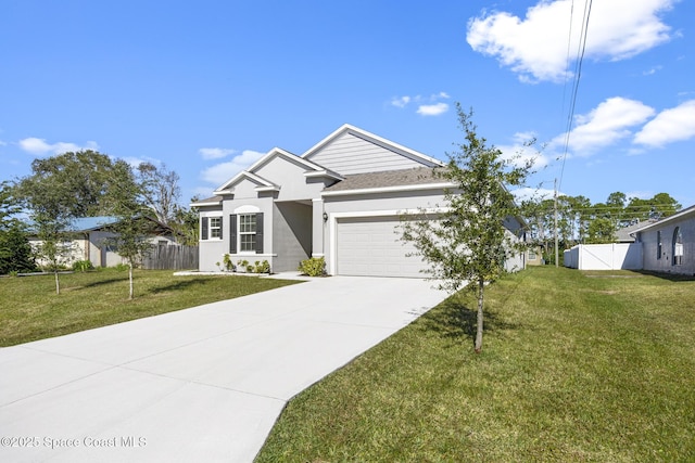 view of front facade featuring a front yard and a garage