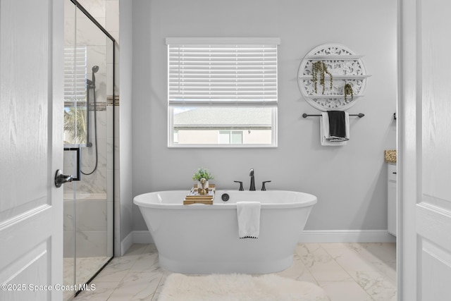 bathroom with plenty of natural light and independent shower and bath