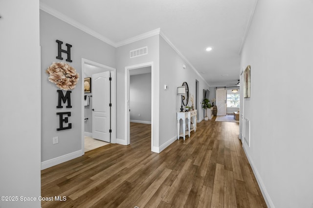 hall featuring ornamental molding and dark wood-type flooring