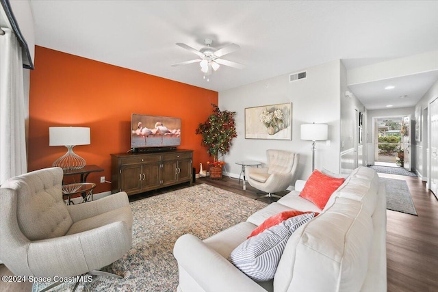 living room featuring hardwood / wood-style flooring and ceiling fan