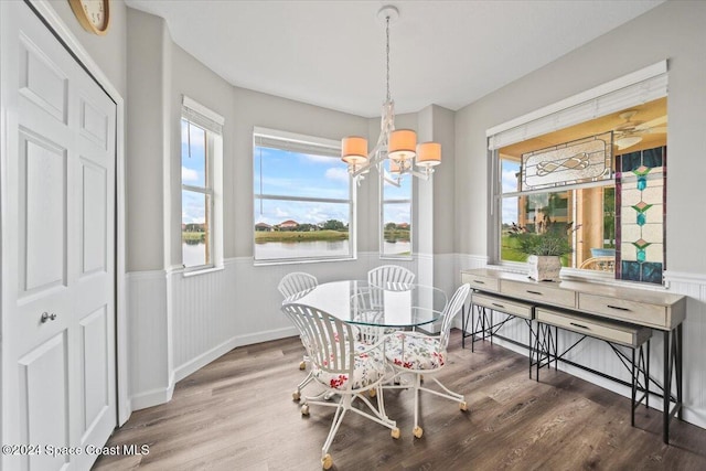 dining area with a chandelier and hardwood / wood-style flooring