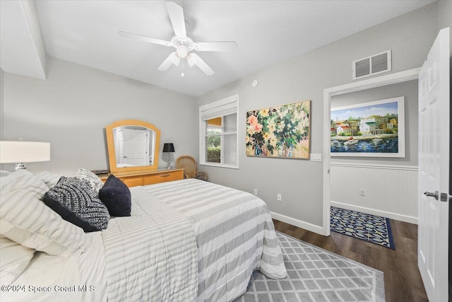 bedroom featuring ceiling fan and dark hardwood / wood-style flooring