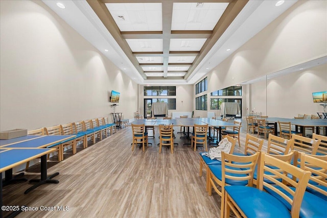 interior space featuring hardwood / wood-style floors and a towering ceiling