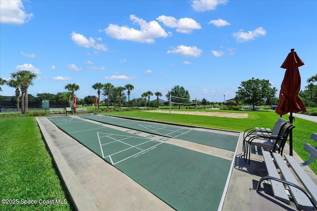 surrounding community featuring volleyball court and a yard