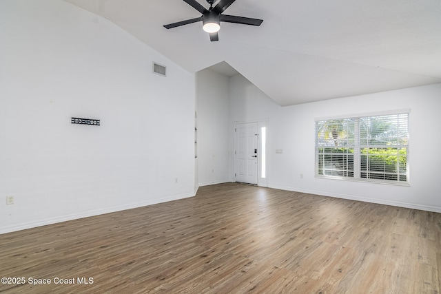 unfurnished living room with ceiling fan, light hardwood / wood-style flooring, and lofted ceiling