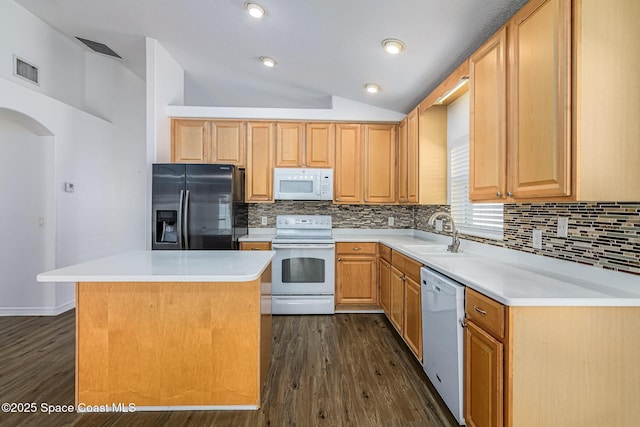 kitchen with lofted ceiling, a kitchen island, sink, white appliances, and dark wood-type flooring