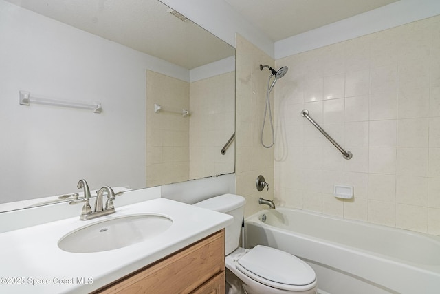 full bathroom with toilet, tiled shower / bath combo, and vanity