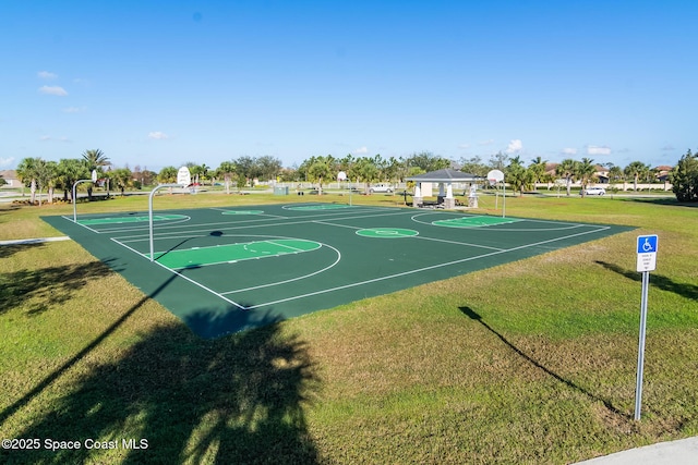 view of basketball court featuring a lawn