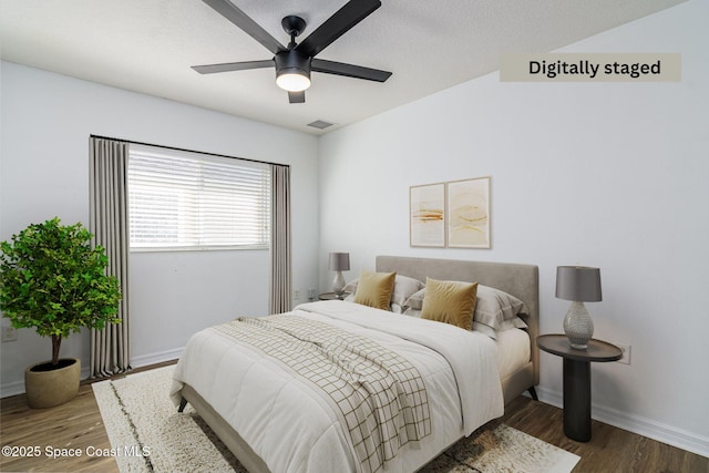 bedroom featuring ceiling fan and hardwood / wood-style floors