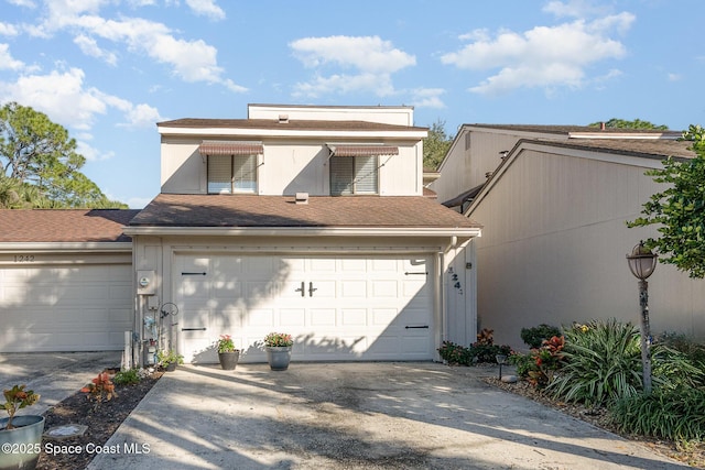 view of front of property with a garage