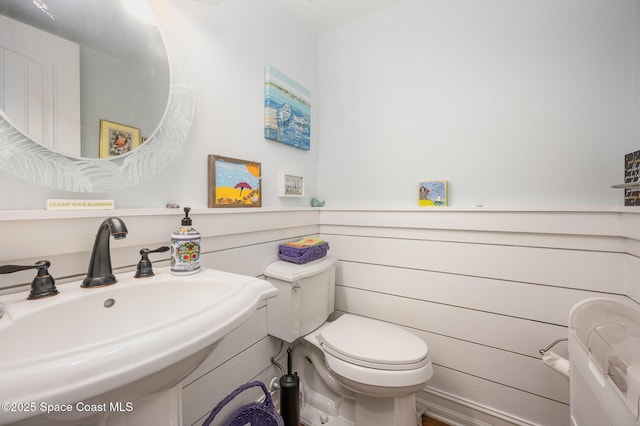 bathroom with toilet and sink