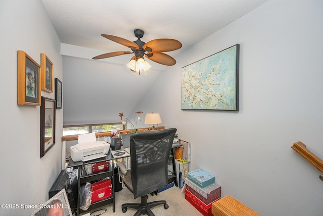 office area featuring ceiling fan, light colored carpet, and vaulted ceiling