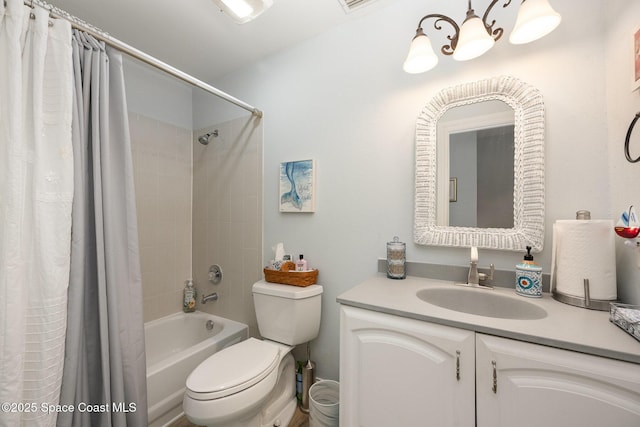 full bathroom with shower / bath combo with shower curtain, vanity, and toilet