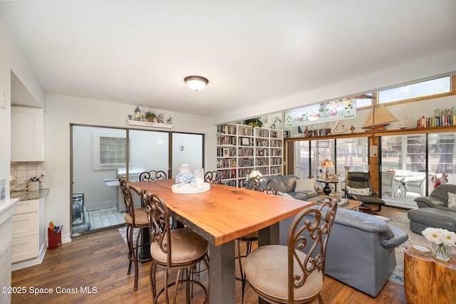 dining space with dark hardwood / wood-style floors