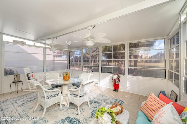 sunroom featuring ceiling fan