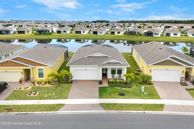 birds eye view of property with a water view