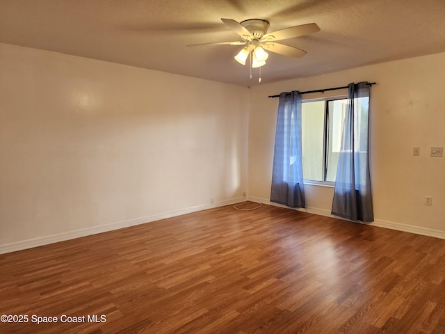 spare room featuring ceiling fan, hardwood / wood-style floors, and a textured ceiling