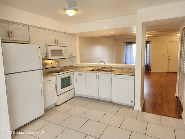 kitchen featuring white cabinetry, sink, ceiling fan, and white appliances