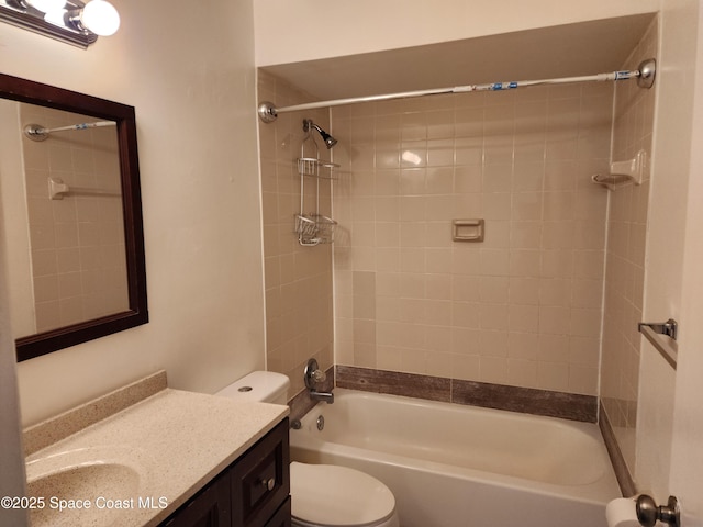 full bathroom with vanity, toilet, and tiled shower / bath combo