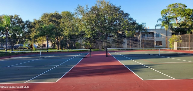 view of sport court featuring basketball hoop