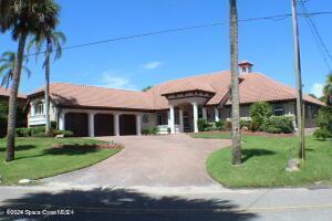 view of front facade featuring a garage and a front lawn