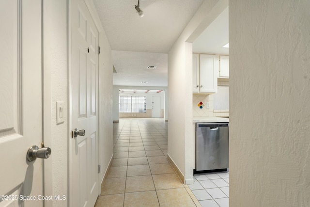 hall with light tile patterned flooring