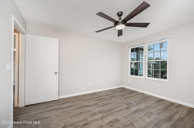 spare room with ceiling fan and hardwood / wood-style floors